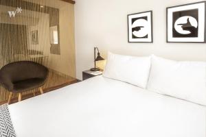 Cama ou camas em um quarto em Las Mimosas by Wynwood House