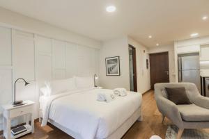 Cama ou camas em um quarto em Las Mimosas by Wynwood House