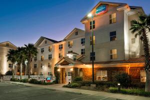 a hotel with a street light in front of a building at TownePlace Suites Pensacola in Pensacola