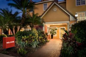 a welcome sign in front of a house at TownePlace Suites Fort Lauderdale West in Fort Lauderdale