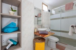 a bathroom with a toilet and a shower at Tiria House Bosa - Casa Vacanze in Bosa