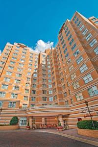 a large apartment building in front of a blue sky at Residence Inn Arlington Rosslyn in Arlington