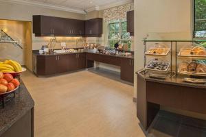 a large kitchen with a bunch of food at Residence Inn Arlington Rosslyn in Arlington