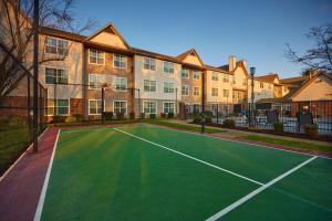 a tennis court in front of a building at Residence Inn Eugene Springfield in Eugene