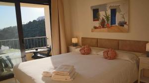 Posteľ alebo postele v izbe v ubytovaní Marbella Resort, Samara By Houselogy