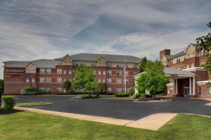 a large building with a parking lot in front of it at Residence Inn by Marriott Cleveland Beachwood in Beachwood