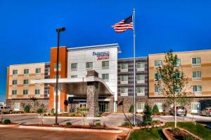 an american flag flies in front of a hotel at Fairfield Inn and Suites Oklahoma City Yukon in Yukon