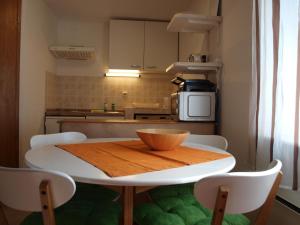 a kitchen with a table with a bowl on it at Apartment Krnica N43 in Krnica