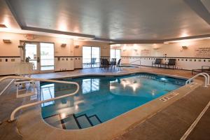 a large indoor swimming pool in a building at Fairfield Inn and Suites by Marriott North Platte in North Platte