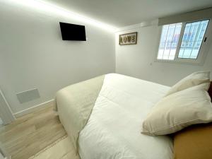 TV a/nebo společenská místnost v ubytování A&C Casa playa Torre del mar-Málaga