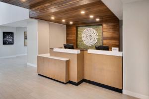 a lobby with a reception desk with two computers at Fairfield Inn & Suites Columbia Downtown in Columbia