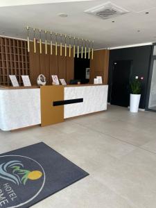 a lobby with a reception desk in a building at Apartman Bella Fruške Residences in Vrdnik