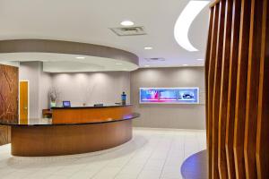 a lobby of a hospital with a reception desk at SpringHill Suites Chesapeake Greenbrier in Chesapeake