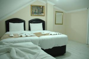 Postel nebo postele na pokoji v ubytování Tolga Hotel