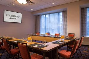 a conference room with a long table and chairs at Courtyard New York Manhattan/Midtown East in New York