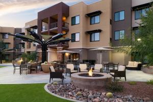 a courtyard with a fire pit in front of a building at Residence Inn by Marriott Scottsdale Salt River in Scottsdale