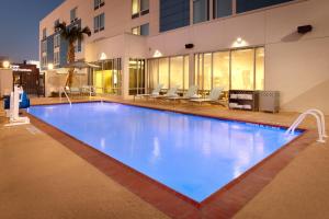 a large swimming pool in front of a building at SpringHill Suites by Marriott Houston I-45 North in Houston