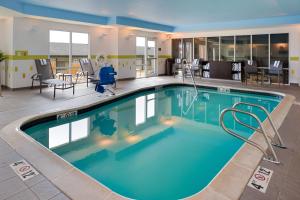 a pool in the middle of a hotel at Fairfield Inn & Suites by Marriott Cedar Rapids in Cedar Rapids