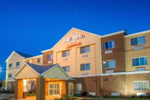 a hotel with a sign on the front of it at Fairfield Inn & Suites Chicago Tinley Park in Tinley Park