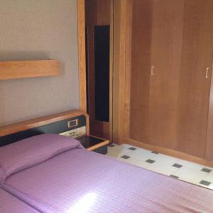 Кровать или кровати в номере Hotel Minicuccio