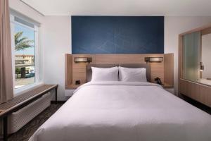 Кровать или кровати в номере SpringHill Suites by Marriott Amelia Island