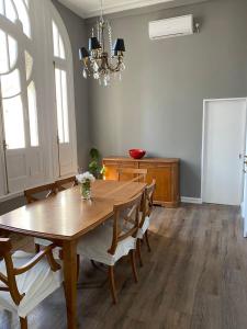 a dining room with a wooden table and chairs at Gorgeous apartment San Telmo up to 6 people in Buenos Aires