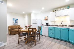 a kitchen with a table and chairs and a couch at Orem Vacation Rental Apartment Near BYU Campus! in Orem