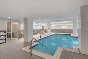 a large swimming pool in a hotel lobby at TownePlace Suites by Marriott Cincinnati Downtown in Cincinnati