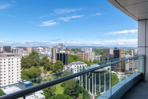 a view of a city from the balcony of a building at Four Points by Sheraton Auckland in Auckland