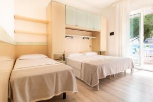 Postel nebo postele na pokoji v ubytování Hotel Ettoral