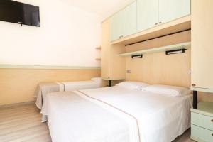Postel nebo postele na pokoji v ubytování Hotel Ettoral