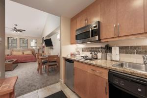 a kitchen and living room with a couch at Fraser Crossing Unit 3618 in Winter Park