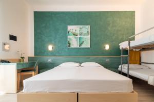 Postel nebo postele na pokoji v ubytování Hotel Ettoral