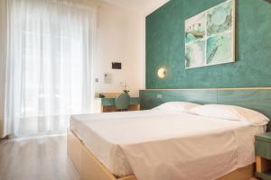 Postel nebo postele na pokoji v ubytování Hotel Ettoral