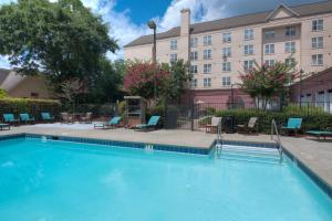 a large swimming pool in front of a hotel at Residence Inn Atlanta Buckhead/Lenox Park in Atlanta