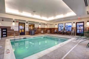 a large swimming pool in a hotel room at Fairfield Inn & Suites by Marriott Springfield Holyoke in Holyoke