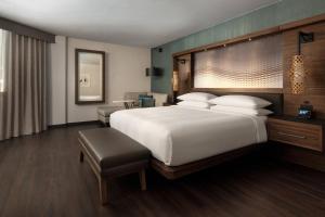 a large white bed in a hotel room at Seattle Airport Marriott in SeaTac