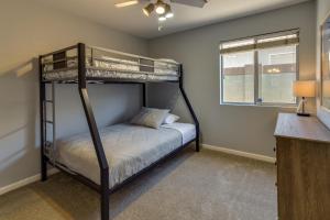 a bedroom with a bunk bed and a window at 5 Mi to Dtwn Gilbert Home with Pool and Patio in Gilbert +19 photos