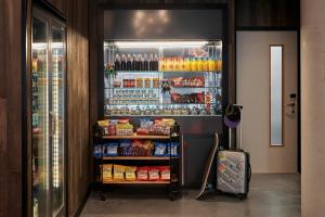 a refrigerator filled with lots of food and drinks at Moxy Slough in Slough