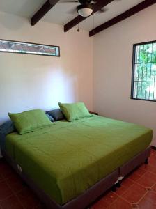 Säng eller sängar i ett rum på Green Papaya