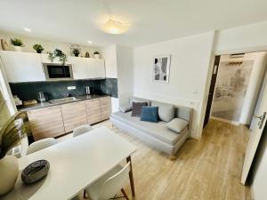 a living room with a couch and a table at Beautiful Apartment Dlouhá in Prague