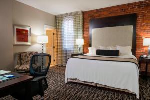 a hotel room with a large bed and a desk at Fairfield Inn & Suites by Marriott Keene Downtown in Keene