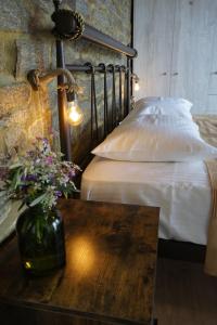 A bed or beds in a room at by karakas Λίθινο