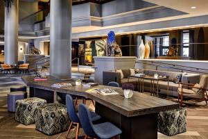 a lobby with a large table and chairs at Renaissance Los Angeles Airport Hotel in Los Angeles