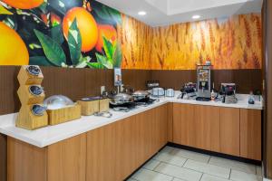 a kitchen with a counter with food on it at Fairfield Inn Tallahassee North/I-10 in Tallahassee