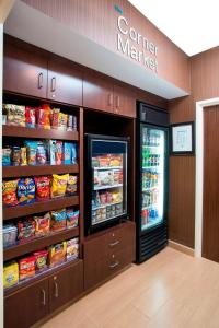 a store with a refrigerator and some food at Fairfield Inn & Suites Greeley in Greeley