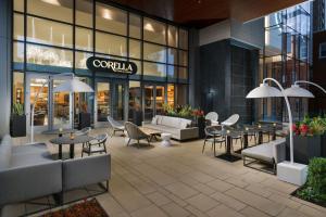 a restaurant with tables and chairs in front of a building at AC Hotel by Marriott Bethesda Downtown in Bethesda