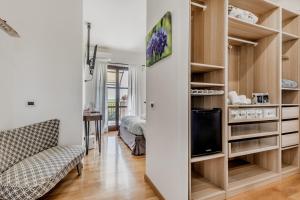 a living room with a couch and a tv at B&B A casa di Giulia in Guidonia