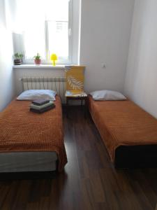 Posteľ alebo postele v izbe v ubytovaní Hostel Staromiejski