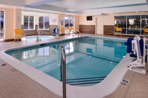 a large swimming pool in a hospital at Fairfield Inn & Suites Louisville North in Jeffersonville
